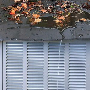 Covered Air Conditioner Protected from Fall Leaves and Rain Water