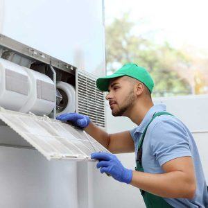 Service Technician Inspects HVAC Equipment