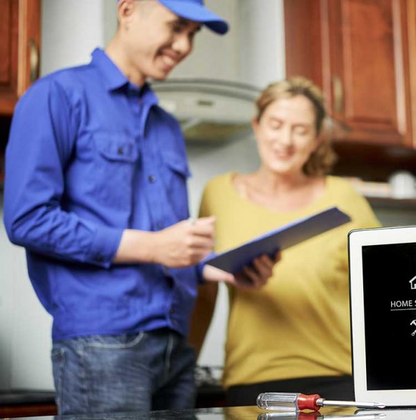 HVAC Technician and Homeowner Discuss Service Options